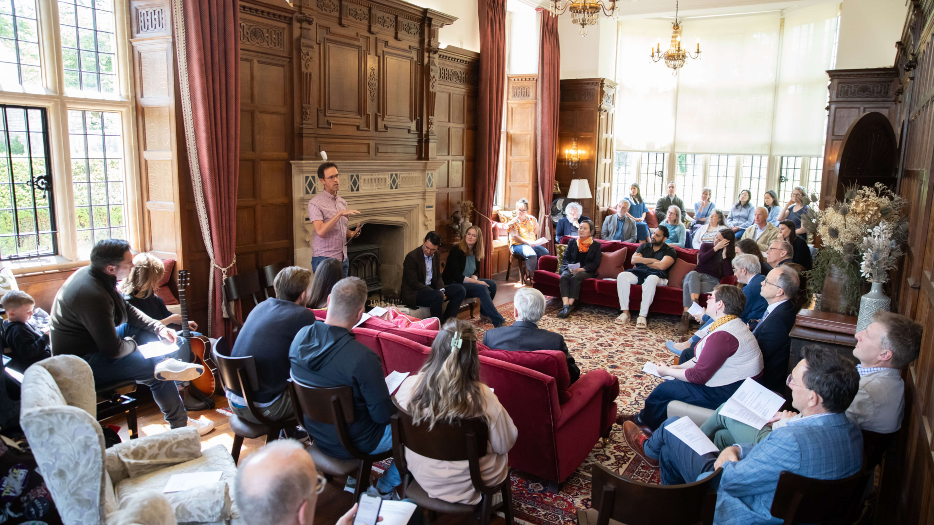Dan leading worship in music room of Yarnton manor.