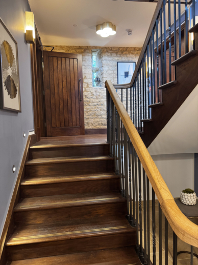 First floor stair case in Yarnton Manor Tithe barn library.
