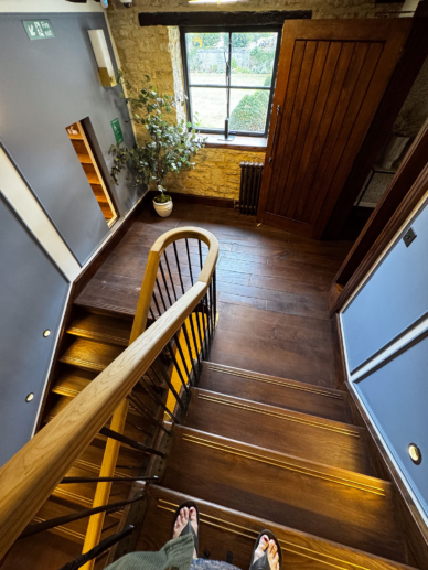Second floor staircase in Yarnton library tithe barn.